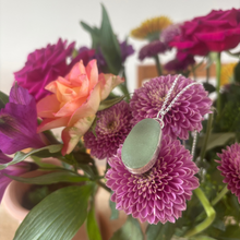 Load image into Gallery viewer, Seaglass pendant on flowers