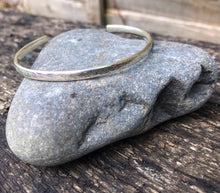 Load image into Gallery viewer, Medium-sized sterling silver adjustable bracelet.
